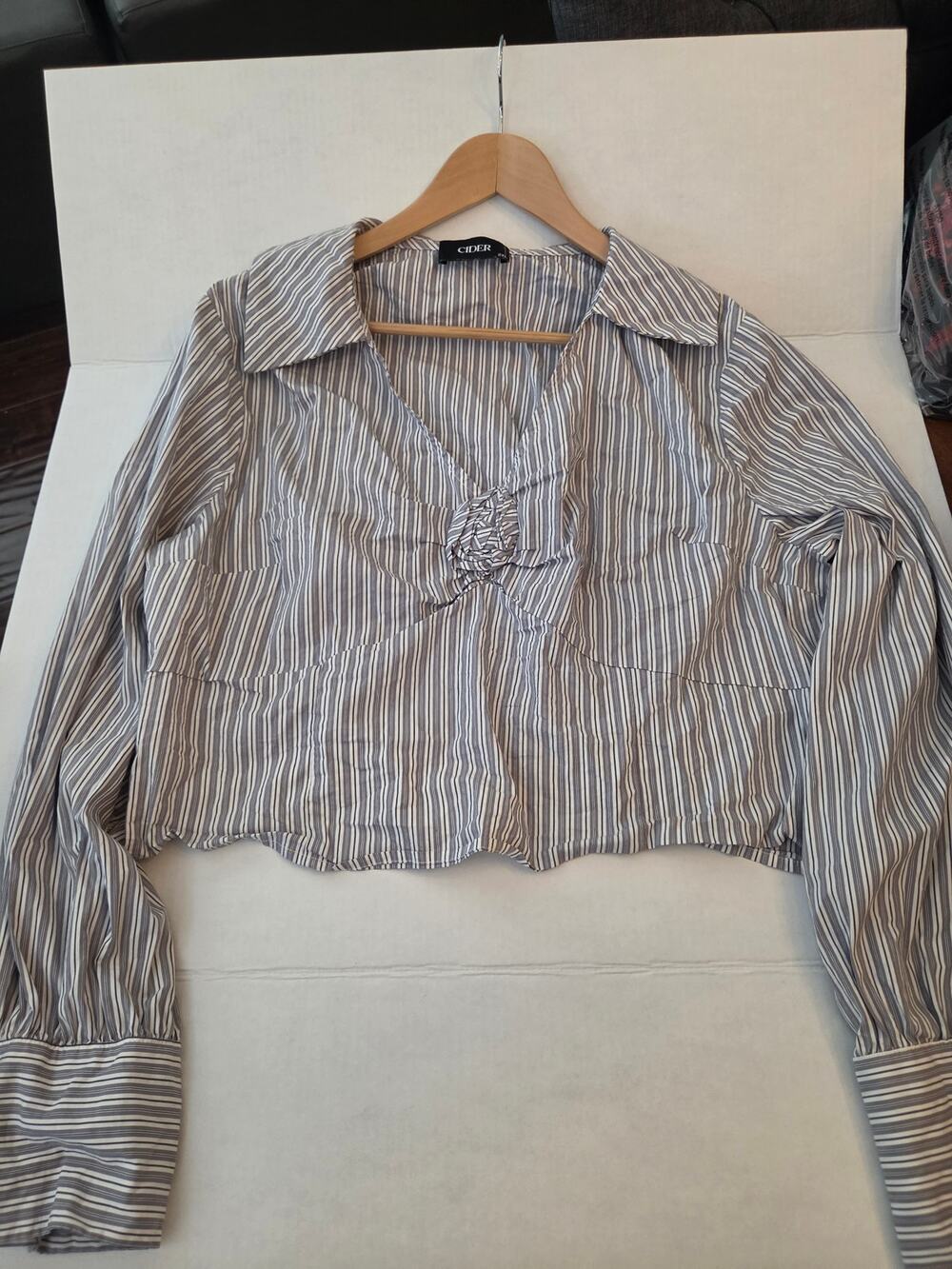 Cider plus size stripped shirt with rosette in front.